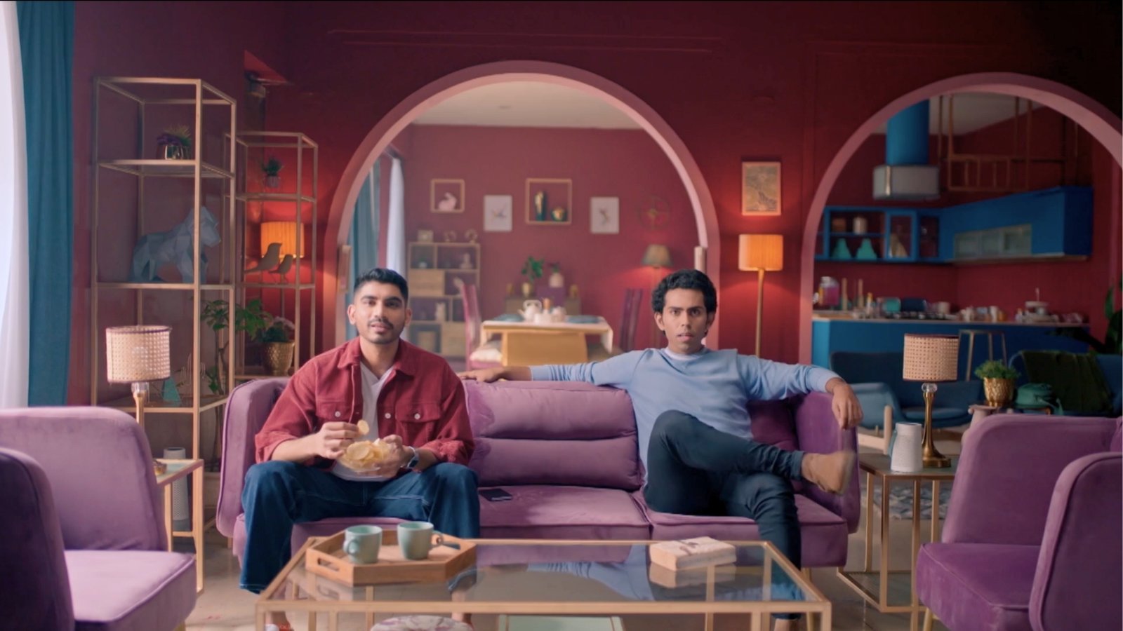 Cinematic living room set designed for an advertising film, featuring bold color palettes and layered interiors by production designer Gautam Kumar
