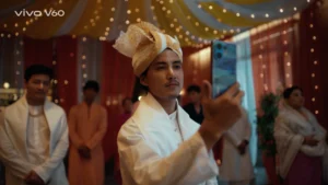 groom taking photo phone manipuri wedding indoor lighting drapes