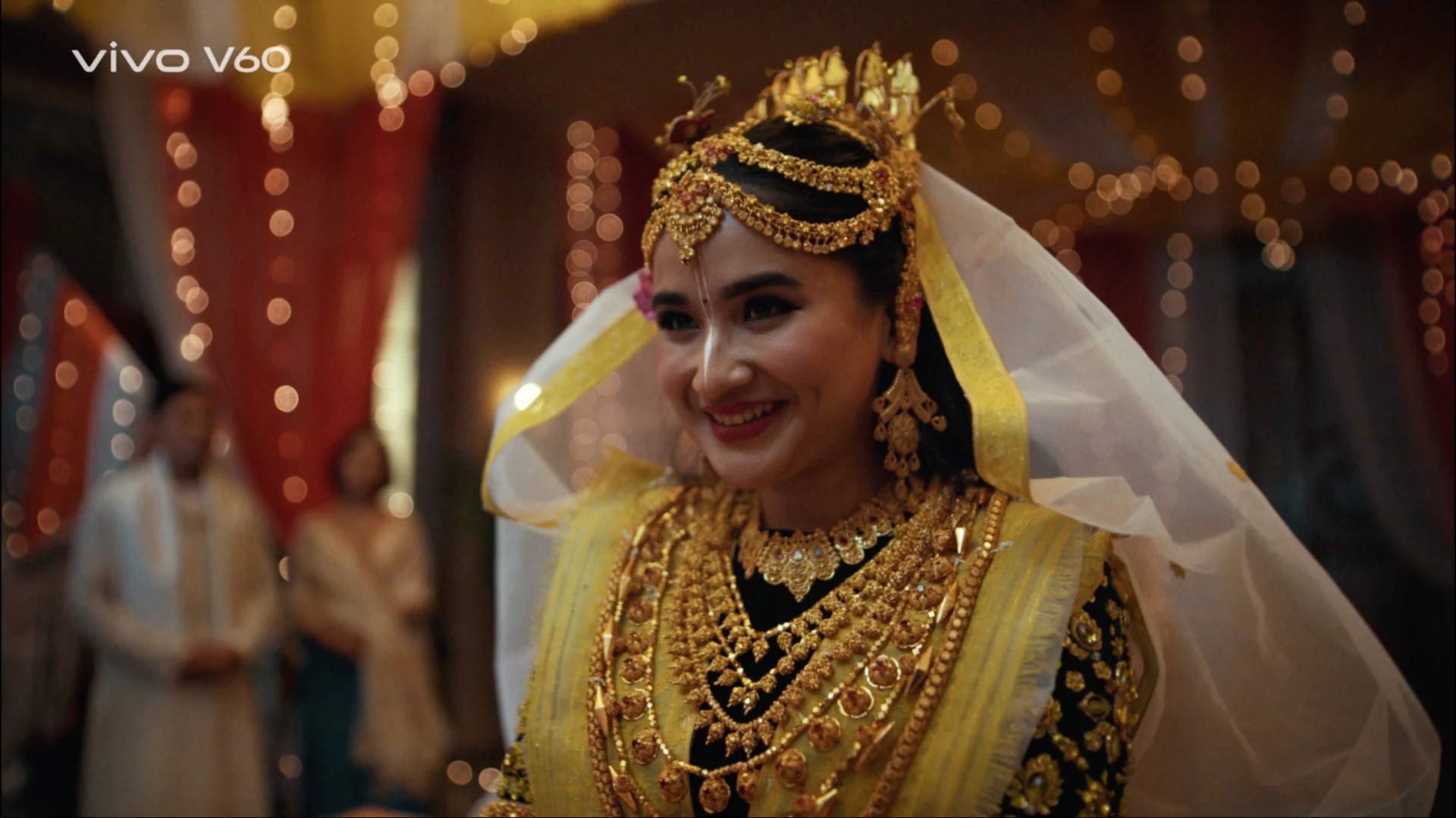 manipuri bride smiling traditional jewelry wedding close shot warm lighting