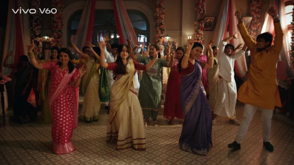 indian wedding group dance colorful outfits warm lighting hall