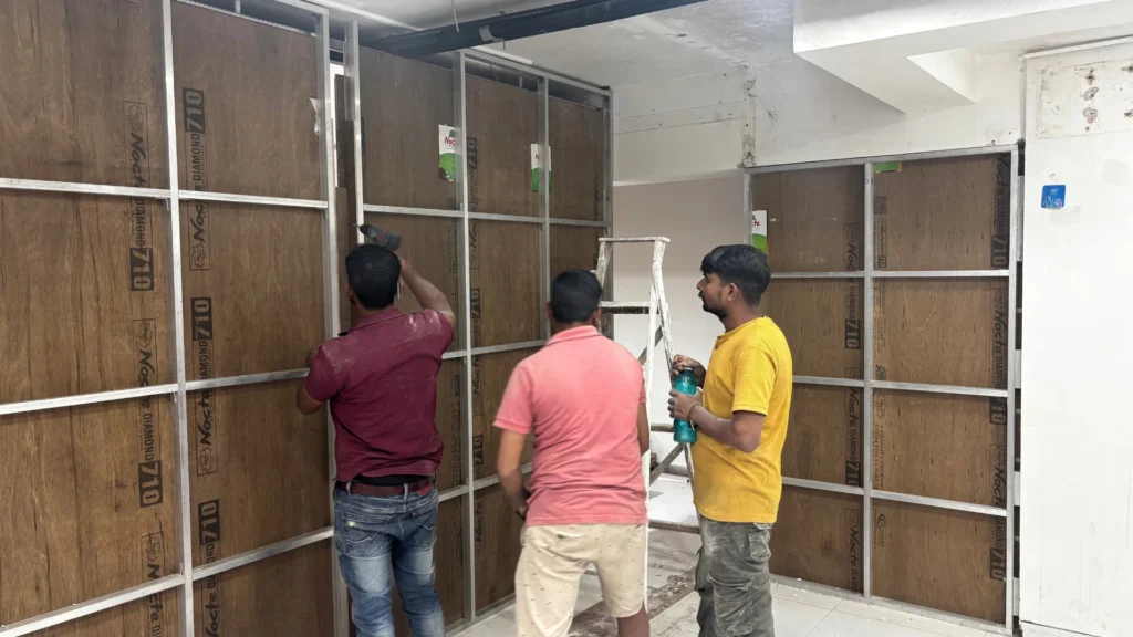 Acoustic wall construction process inside compact soundproof content studio