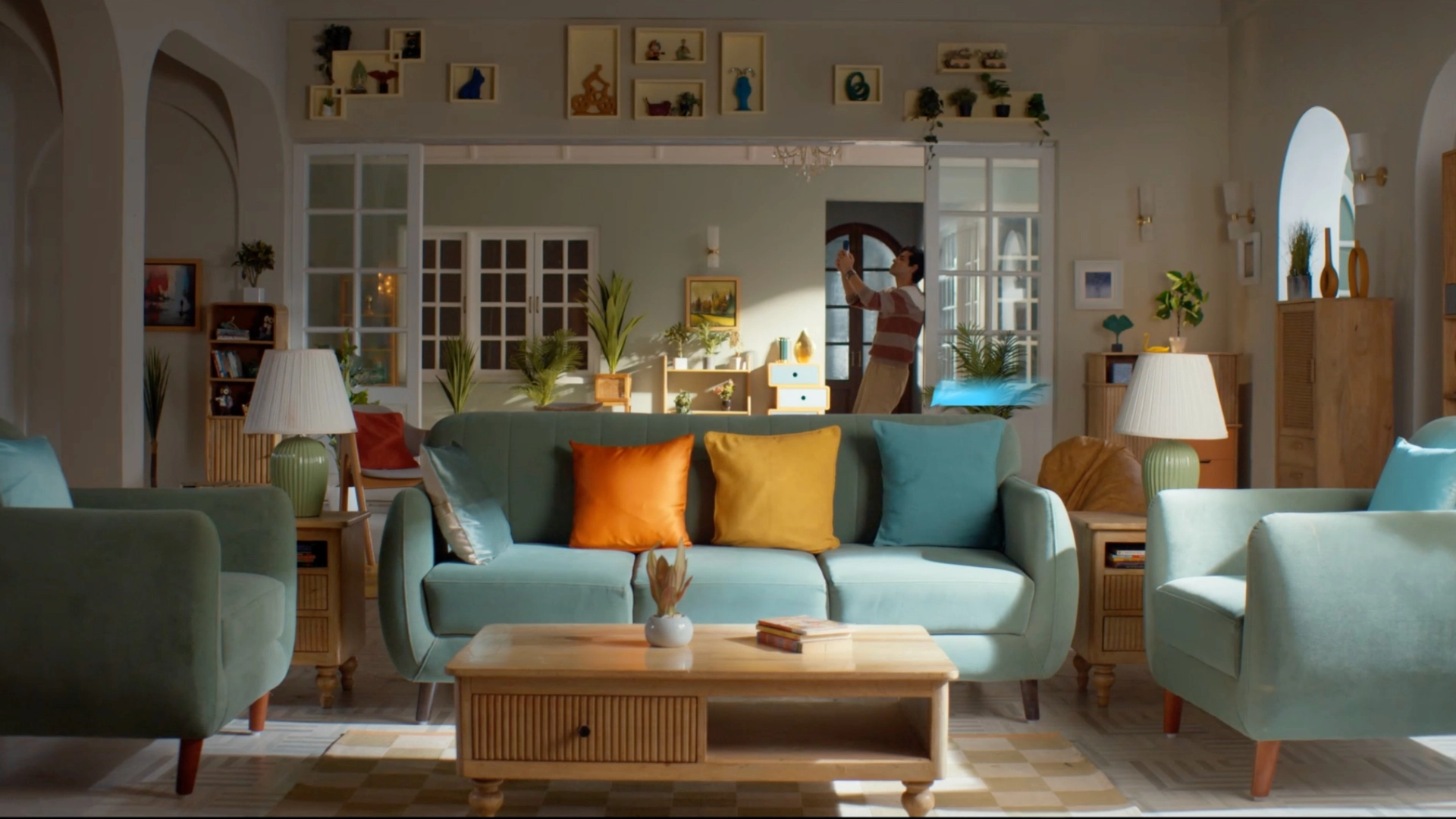 Bright modern Indian living room set with pastel furniture, wooden decor accents, and cinematic daylight styling for an advertisement shoot.