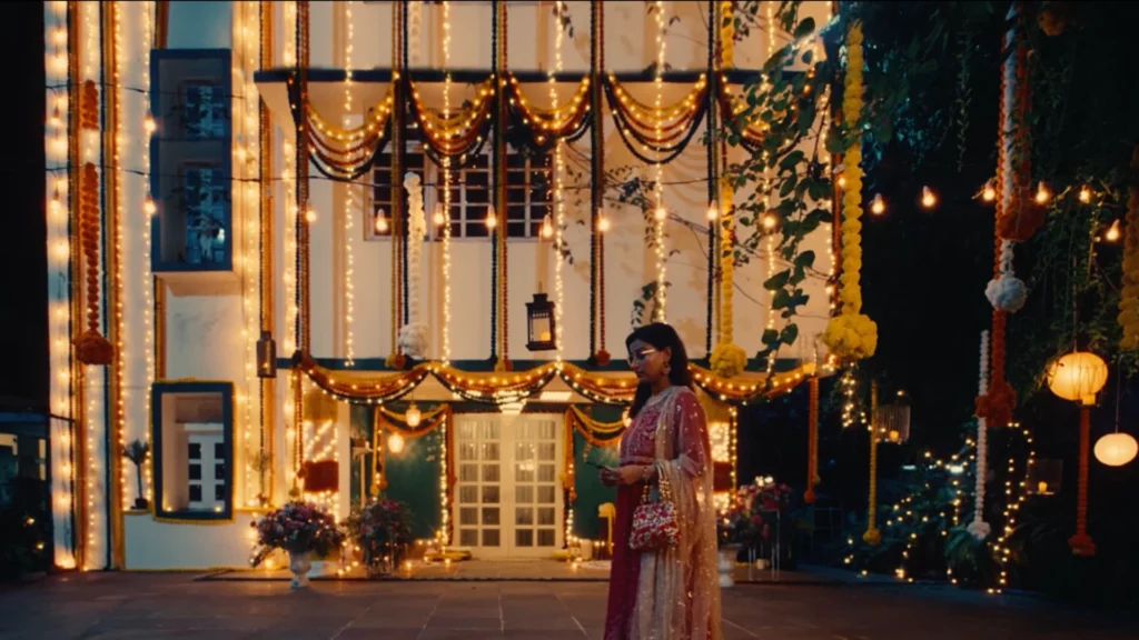 Decorated festive house exterior with fairy lights, garlands and warm evening ambience designed by Set Craft.