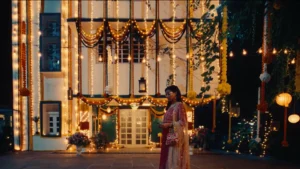 Decorated festive house exterior with fairy lights, garlands and warm evening ambience designed by Set Craft.