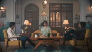 Colonial-style living room film set with vintage furniture, warm lamps, and cinematic heritage interiors.