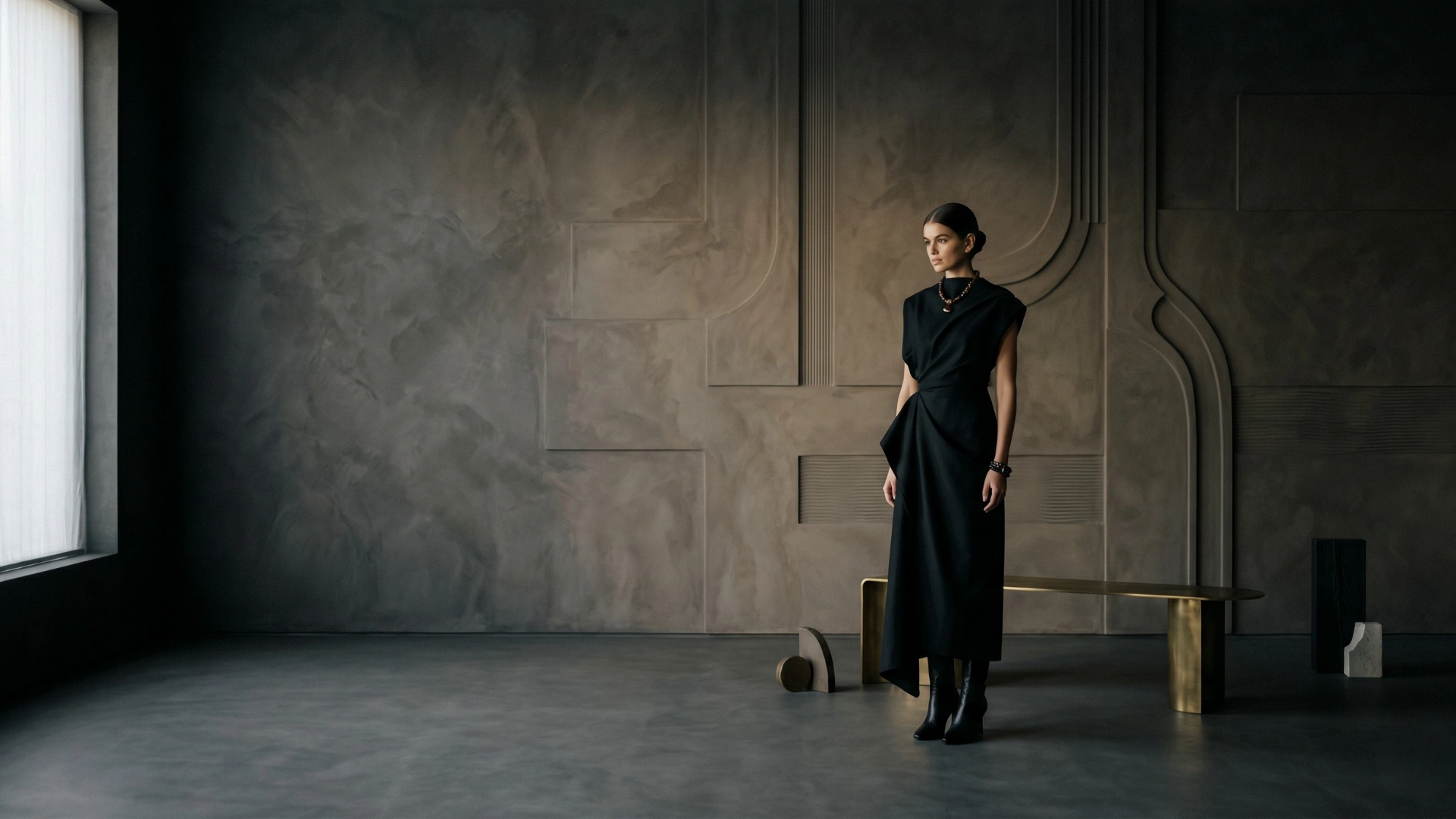 Cinematic noir interior composition featuring sculptural wall detailing, muted textures, atmospheric lighting, and minimalist spatial styling by Set Craft Atelier.