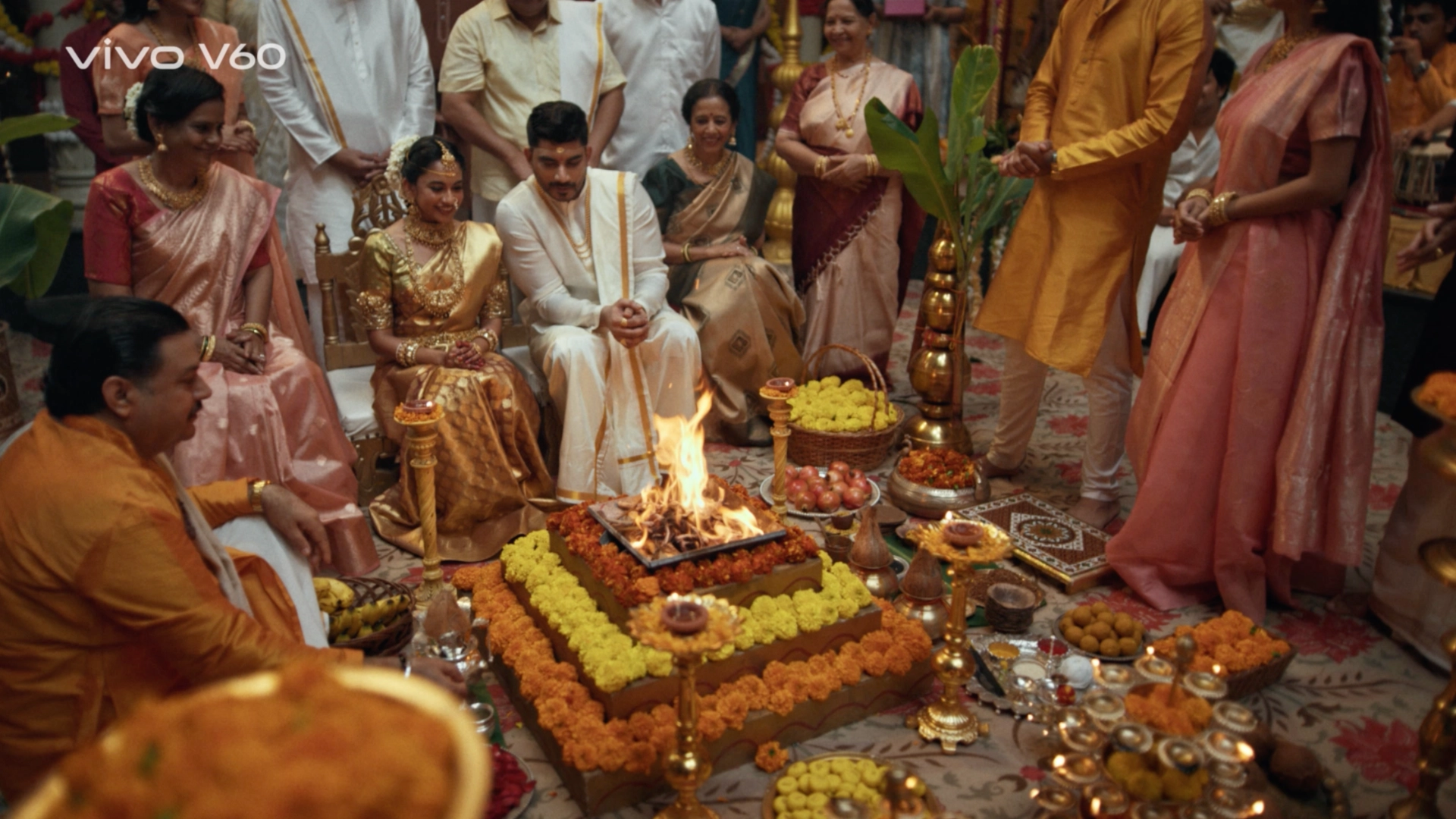 Traditional South Indian wedding ceremony set with floral decor, brass elements and warm festive lighting.