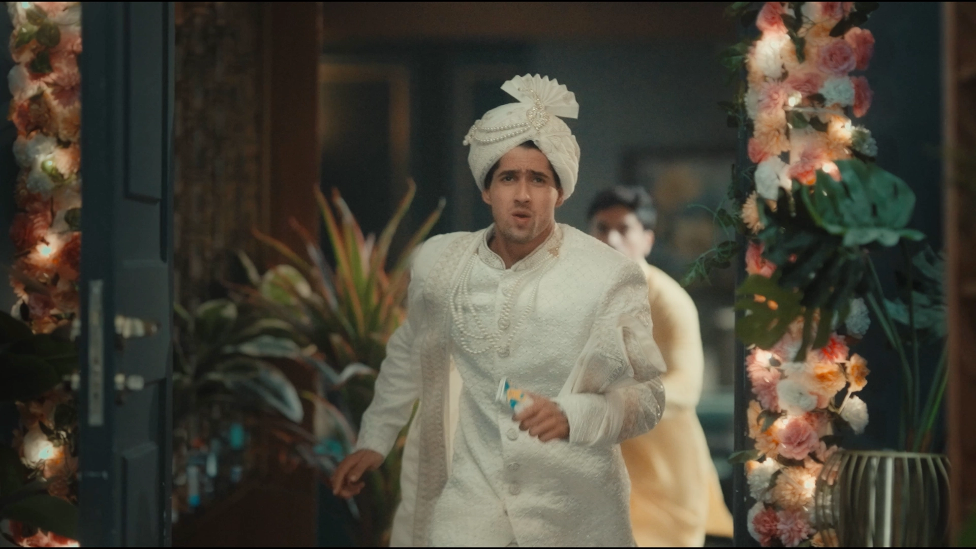 Grand wedding entrance setup with floral decor and groom entry styling for a cinematic wedding sequence.