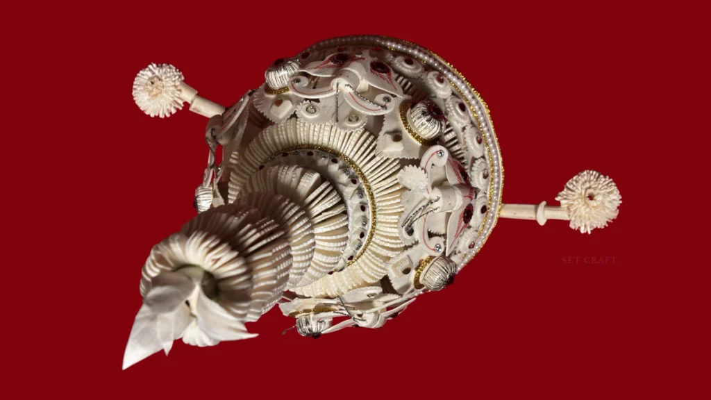 Close-up detail of a traditional Bengali groom shola mukut used in Vivo Wedding Films.