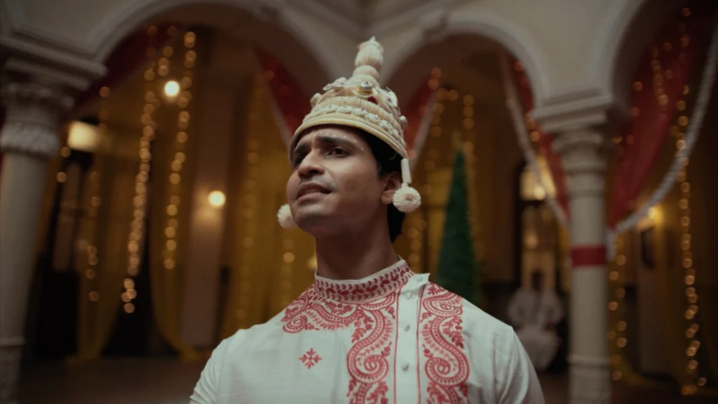 Bengali groom wearing traditional shola mukut within a heritage-inspired wedding set designed by Set Craft.