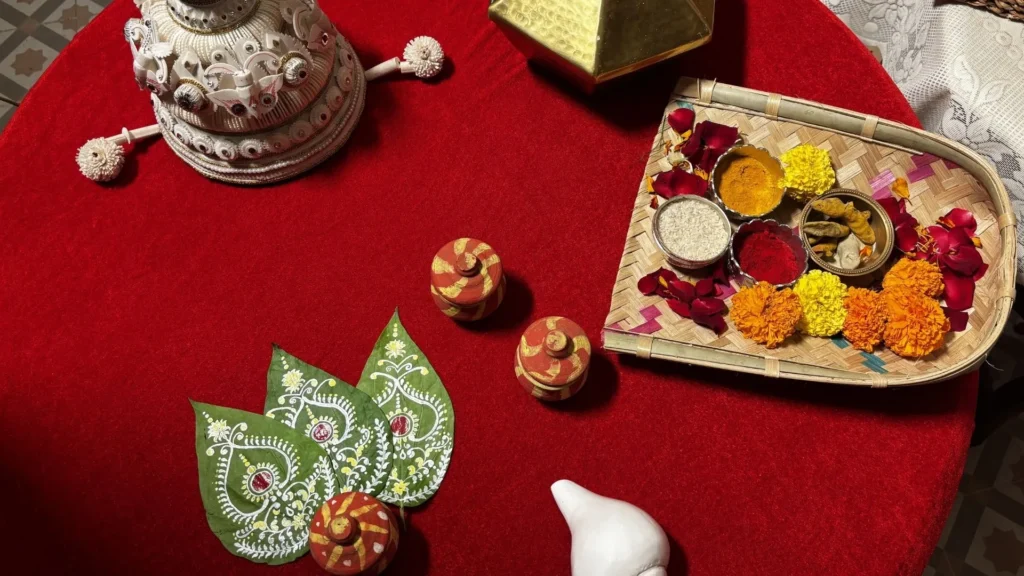 Traditional Bengali wedding ritual props prepared for Vivo Wedding Films including betel leaves, turmeric, vermilion and ceremonial accessories.