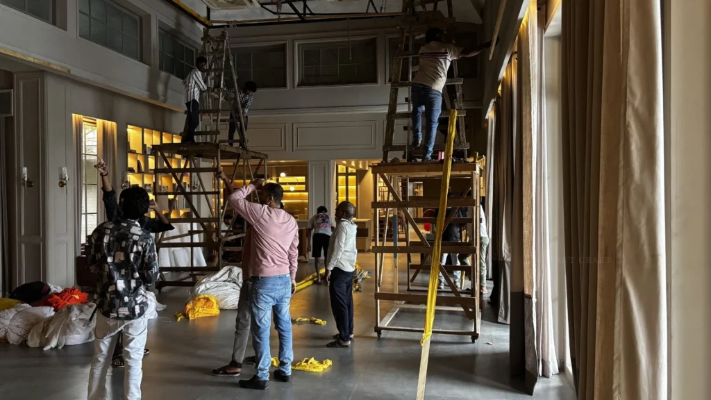 Set Craft team installing drapery and wedding décor for Vivo Wedding Films.