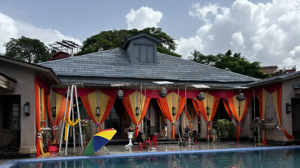 Exterior wedding set dressing and drapery installation for a commercial film production
