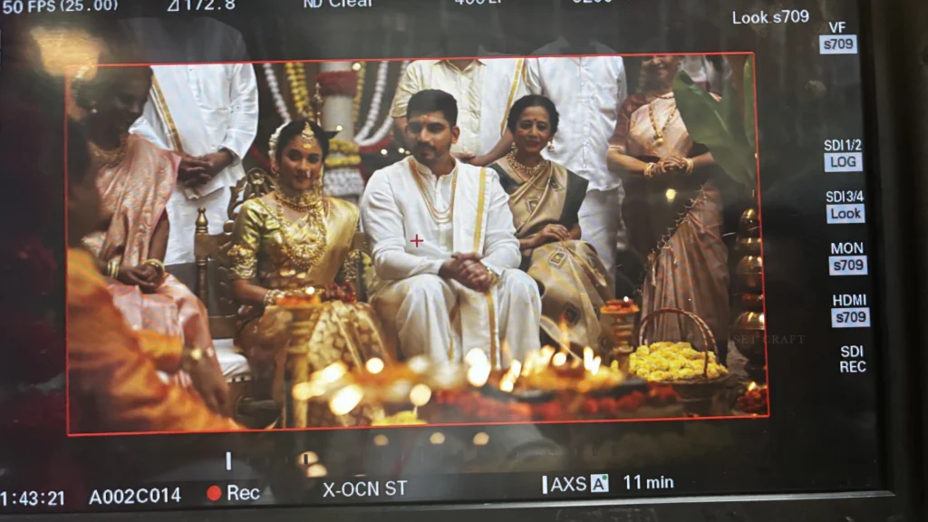 Camera monitor displaying wedding ceremony scene filmed within a custom-designed wedding set by Set Craft.