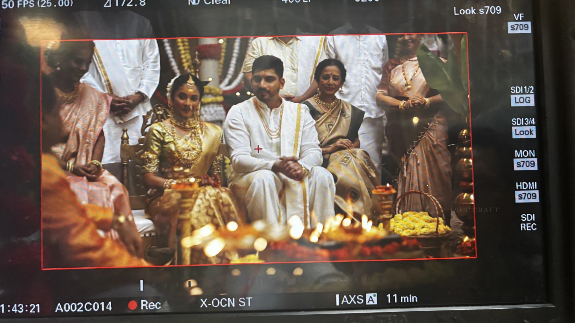 Camera monitor displaying wedding ceremony scene filmed within a custom-designed wedding set by Set Craft.