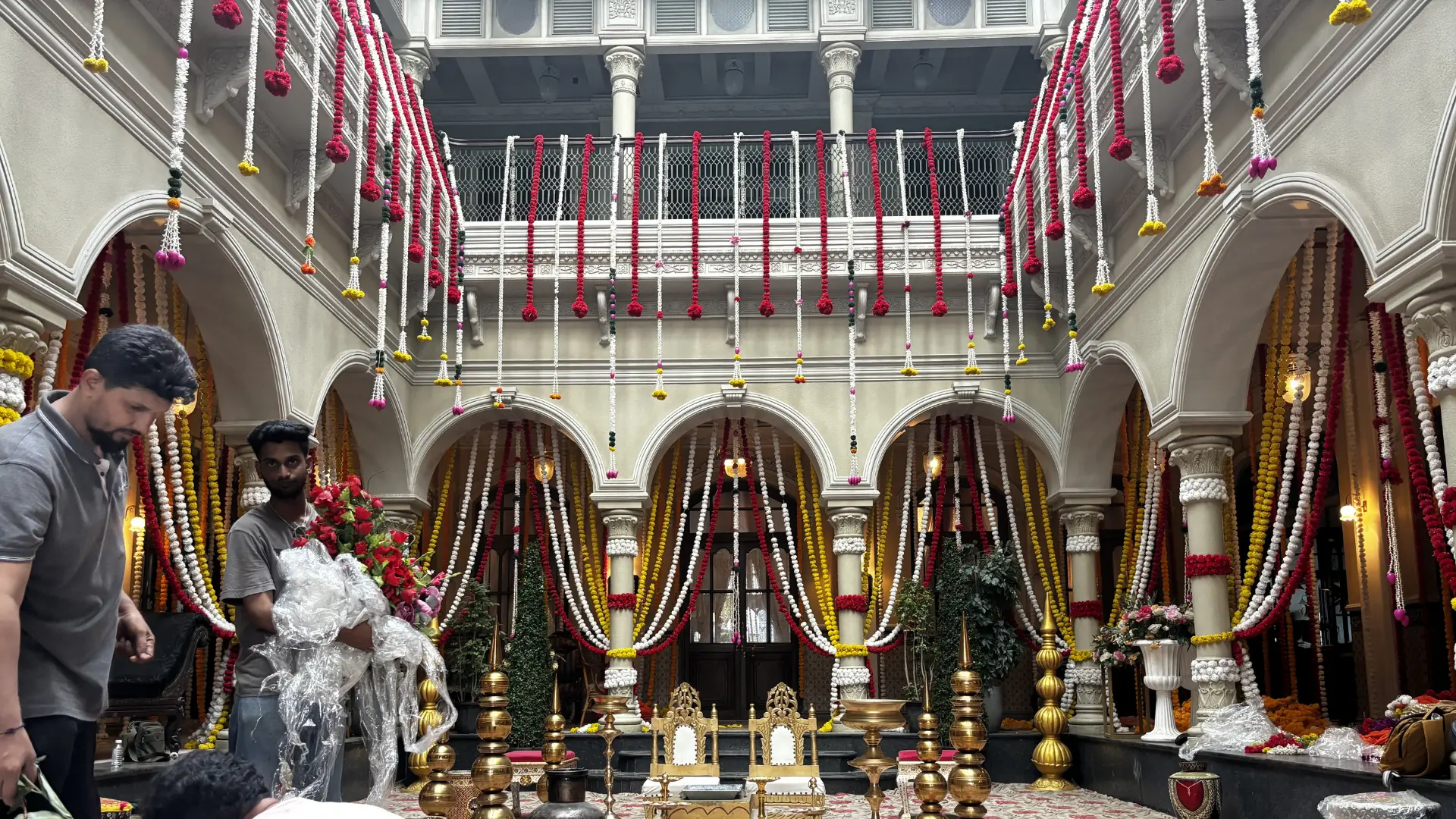 Behind the scenes of a South Indian wedding set designed by Set Craft featuring heritage courtyard architecture, floral garlands and ceremonial staging for Vivo wedding film.