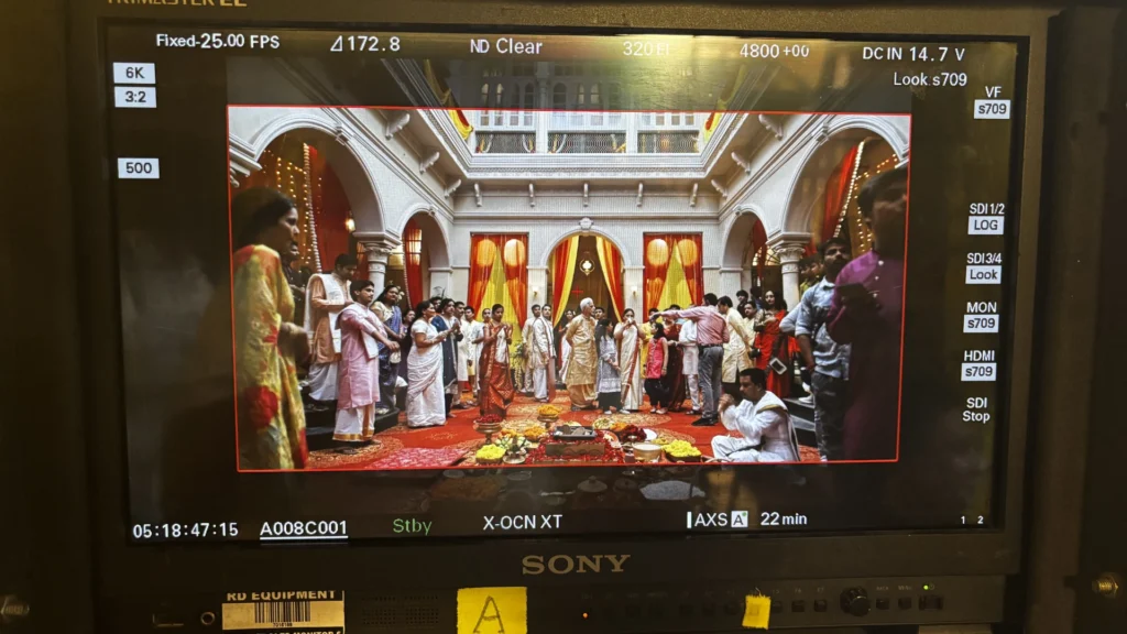 Production monitor displaying a Bengali wedding scene during filming for Vivo Wedding Films.