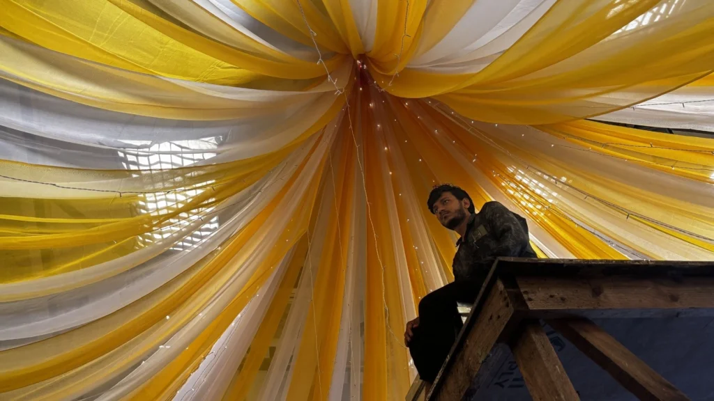 Wedding set ceiling drapery under construction by Set Craft's installation team.